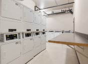 Thumbnail 11 of 15 - a room filled with white machines and a table