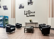 Thumbnail 10 of 15 - the lobby with chairs and a table