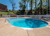 Thumbnail 18 of 25 - A small pool with a white fence around it.