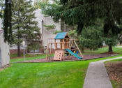 Thumbnail 10 of 18 - a swing set in the backyard of a house