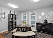 Thumbnail 11 of 16 - a dining room with a table and chairs