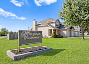 Thumbnail 15 of 16 - the front yard of a house with a sign that says mariposa gardens