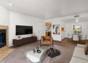 Thumbnail 2 of 18 - a living room with a fireplace and a flat screen tv