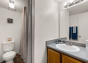 Thumbnail 8 of 18 - a bathroom with a toilet sink and mirror