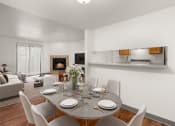 Thumbnail 3 of 18 - a dining area with a table and chairs and a fireplace in the background