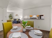 Thumbnail 4 of 18 - a dining area with a table and chairs and a living room in the background