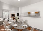 Thumbnail 1 of 25 - A dining room with a table set for a meal.