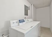Thumbnail 10 of 12 - resident laundry room with washer/dryer at apartment complex