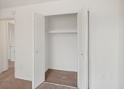 Thumbnail 11 of 16 - bedroom with connected walk-in closet