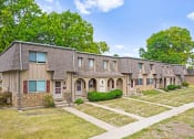Thumbnail 28 of 29 - a row of houses with trees in the background