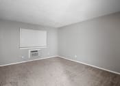 Thumbnail 8 of 29 - an empty room with a window and a radiator