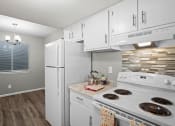 Thumbnail 2 of 29 - a kitchen with white appliances and white cabinets