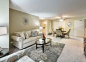 Thumbnail 7 of 32 - a living room with a couch and a table