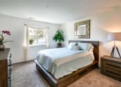 Thumbnail 2 of 32 - a bedroom with a bed and a window