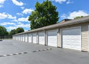 Thumbnail 23 of 32 - apartment complex with garages
