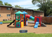 Thumbnail 9 of 12 - a playground with a slide at Nantucket Gardens Apartments