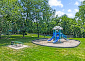 Thumbnail 23 of 25 - a playground with a blue swing set