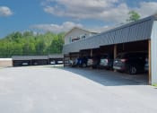 Thumbnail 23 of 32 - a parking lot with cars in it and a building in the background