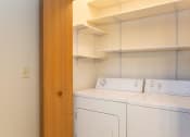 Thumbnail 10 of 32 - a laundry room with a washer and dryer
