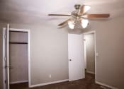 Thumbnail 3 of 20 - bedroom area with closet and overhead light and fan