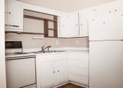 Thumbnail 1 of 20 - kitchen with oven and refrigerator at northwind apartments