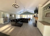 Thumbnail 16 of 33 - lounge area with sofa and tv at old farm shores apartments