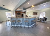 Thumbnail 18 of 33 - clubhouse kitchen area at old farm shores apartments in grand rapids