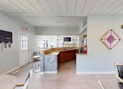 Thumbnail 12 of 35 - A kitchen with a wooden counter and a white ceiling.