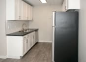 Thumbnail 6 of 26 - fully equipped kitchen at Rochester MN apt