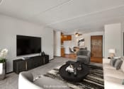 Thumbnail 8 of 26 - a living room with a couch and a tv
