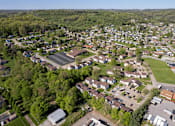 Thumbnail 20 of 20 - A bird's eye view of a residential area with houses and greenery.