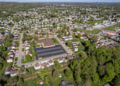 Thumbnail 19 of 20 - A bird's eye view of a residential area with a large building in the center.