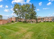 Thumbnail 14 of 16 - large open grassy space at miller west apartments