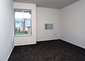 Thumbnail 7 of 15 - A room with a window and a wall-mounted TV.