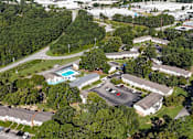 Thumbnail 20 of 21 - An aerial view of a residential complex with a swimming pool.