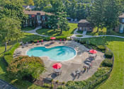 Thumbnail 20 of 23 - an aerial view of a swimming pool and patio with umbrellas