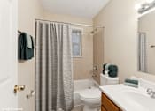 Thumbnail 3 of 16 - bathroom with a shower tub, toilet, and sink
