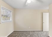 Thumbnail 4 of 16 - bedroom with a ceiling fan and carpeting