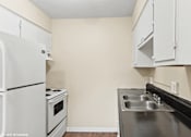 Thumbnail 7 of 16 - kitchen with white appliances and cabinets