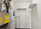 Thumbnail 12 of 16 - the interior of a room with a water heater
