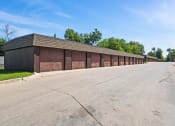 Thumbnail 11 of 33 - apartment complex with row of garages