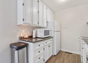 Thumbnail 28 of 33 - clubhouse kitchen with a microwave and a refrigerator