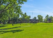 Thumbnail 17 of 33 - apartment community with green grass