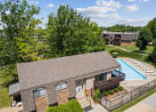 Thumbnail 12 of 33 - an aerial view of a clubhouse with a pool