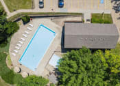 Thumbnail 20 of 33 - an aerial view of a swimming pool and clubhouse
