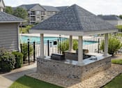 Thumbnail 20 of 33 - A gazebo with a hot tub sits in a backyard.