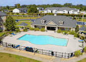 Thumbnail 23 of 33 - A large house with a pool in the backyard.