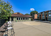 Thumbnail 18 of 23 - A sunny day at the outdoor basketball court.