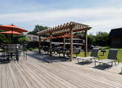 Thumbnail 13 of 18 - community deck lounge area at preserve at woodland apartments