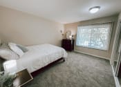 Thumbnail 6 of 18 - a bedroom with a bed and a window
